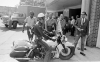 A police officer on a motorcycle rolls his machine in front of civil rights leaders Rev. Ralph Abernathy, left, and Rev. Martin Luther King Jr., center, as they lead a march protesting against segregation, in Birmingham, Ala., on April 12, 1963. 